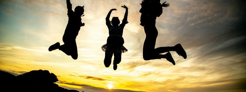 silhouette of jumping people